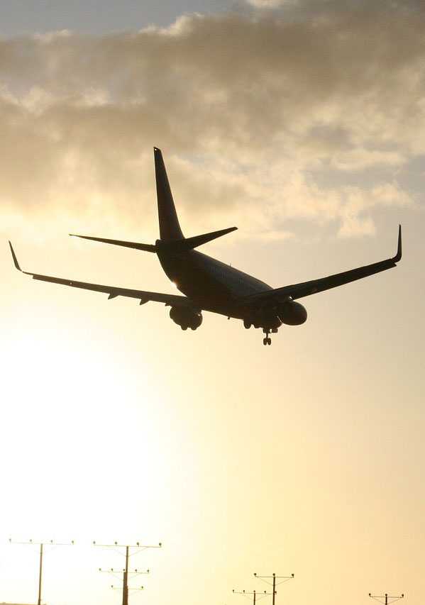 sunset and airplane landing - Spartan College