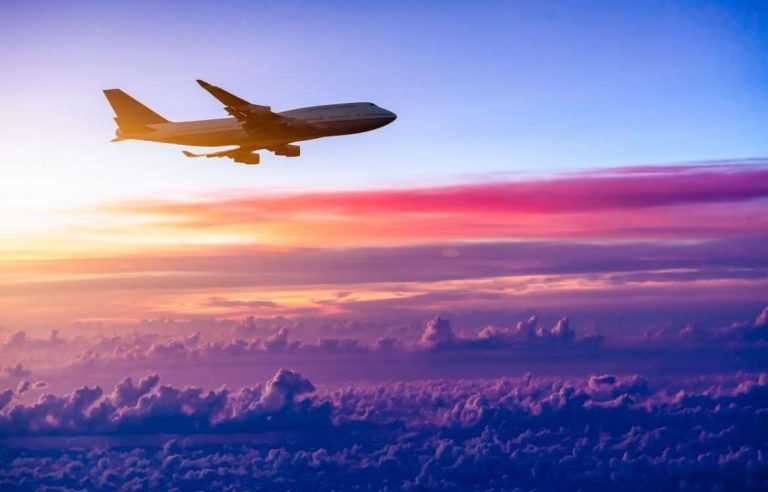 Airplane in the Sky above clouds