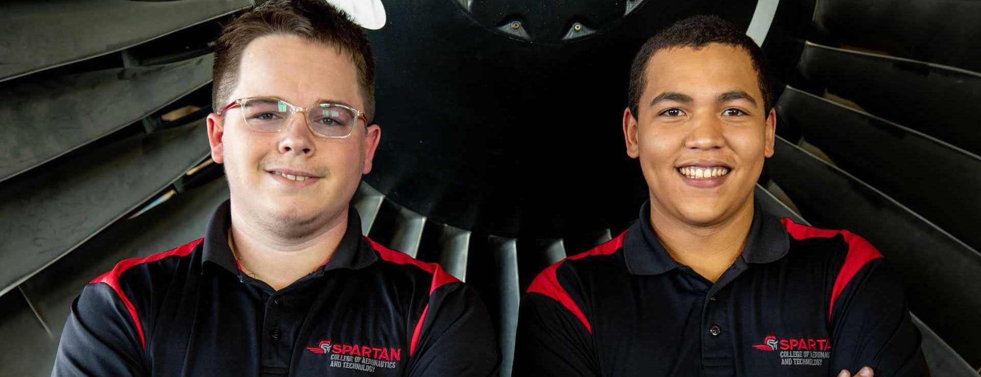 Spartan Tulsa students in front of turbine