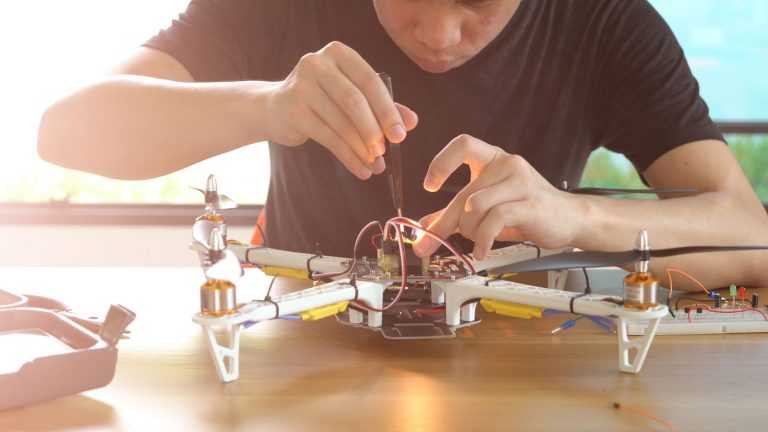 man working on avionics