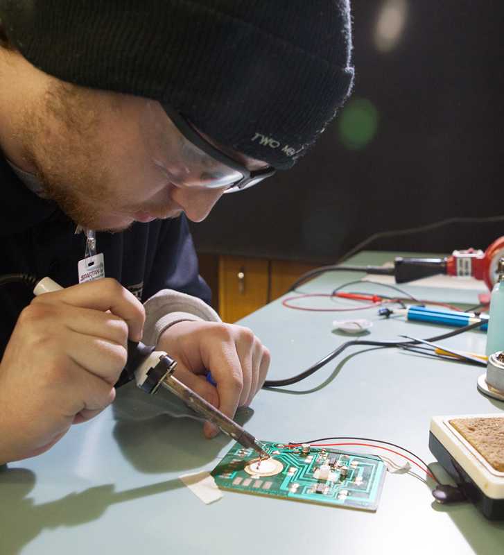 Avionics Technician Student-Soldering Circuit board Spartan College