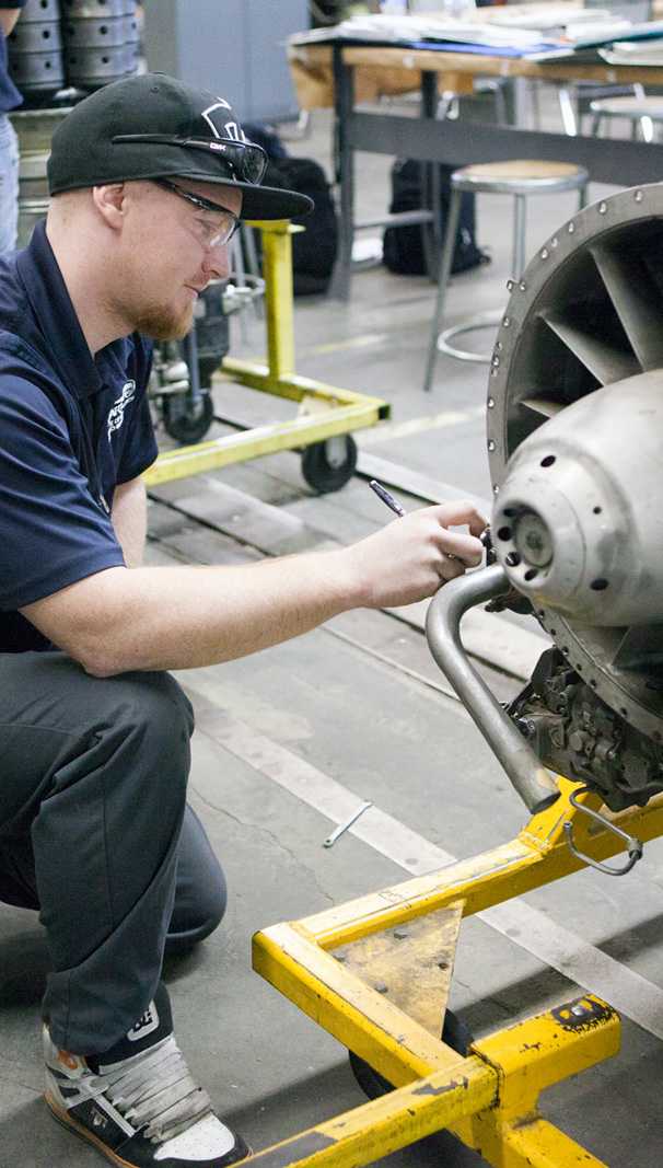 Guy Working on Engine Spartan College