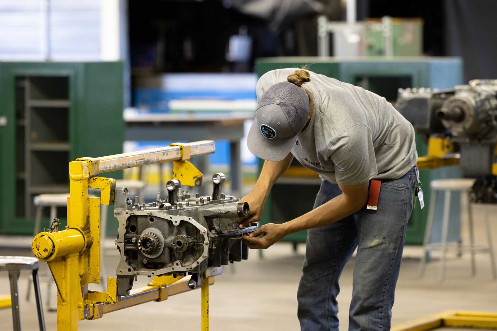 AMT Student working on engine