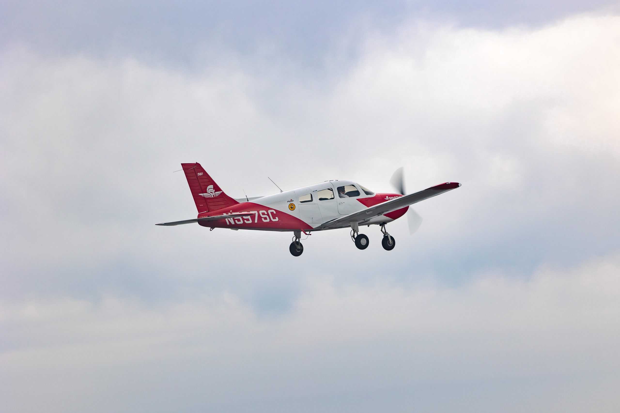 spartan plane in flight behind