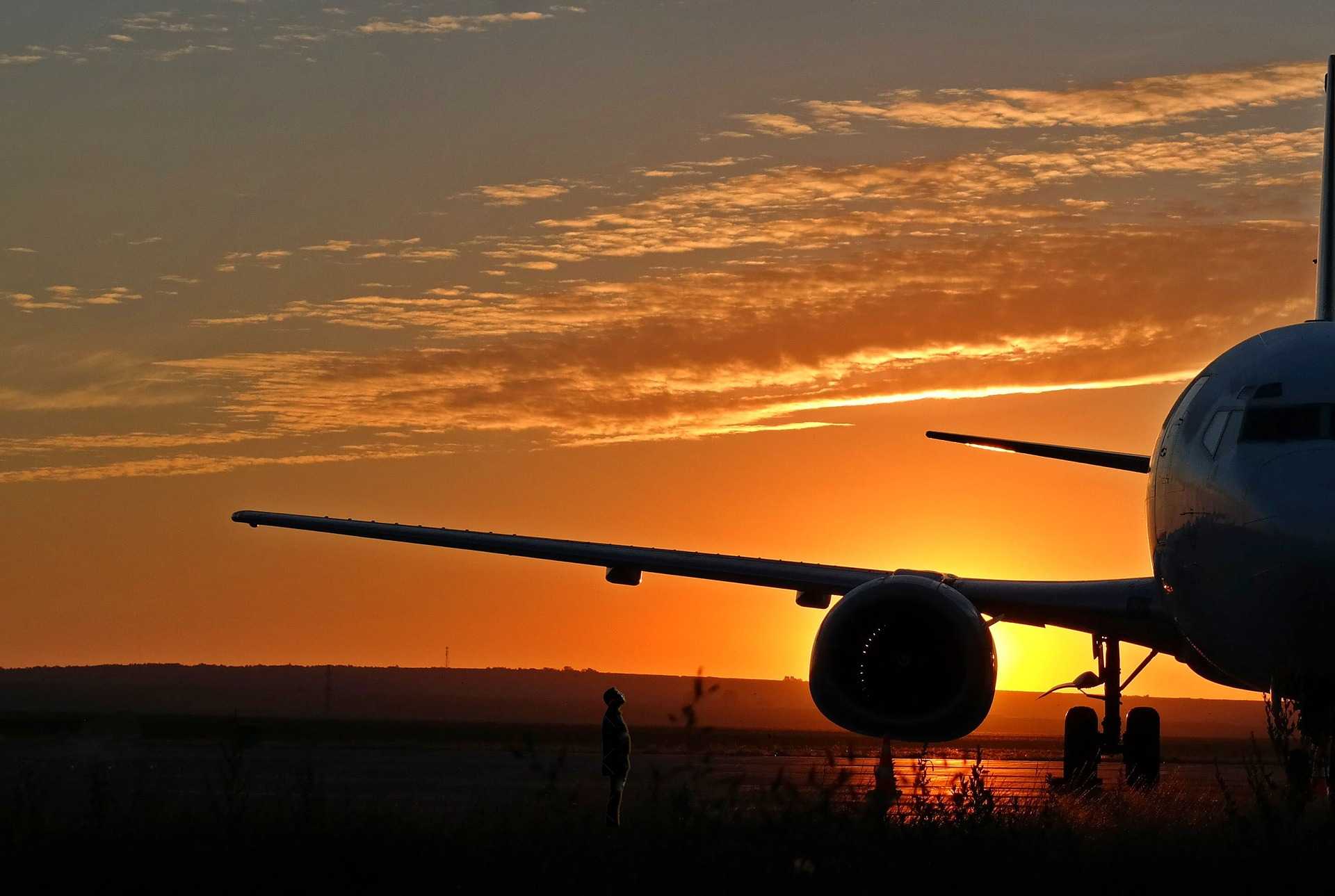 airplane on runway at dawn