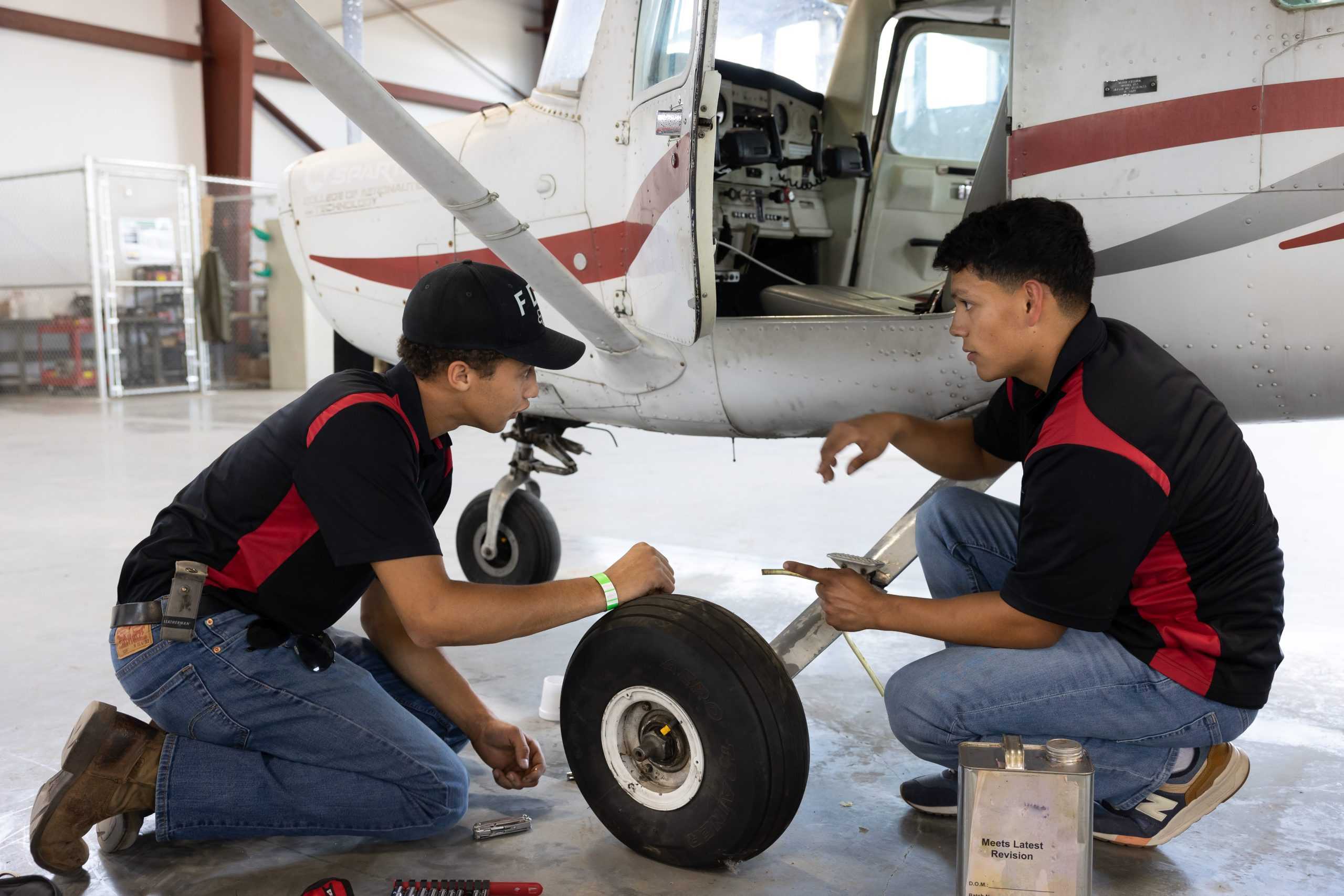 Spartan Students working on plane