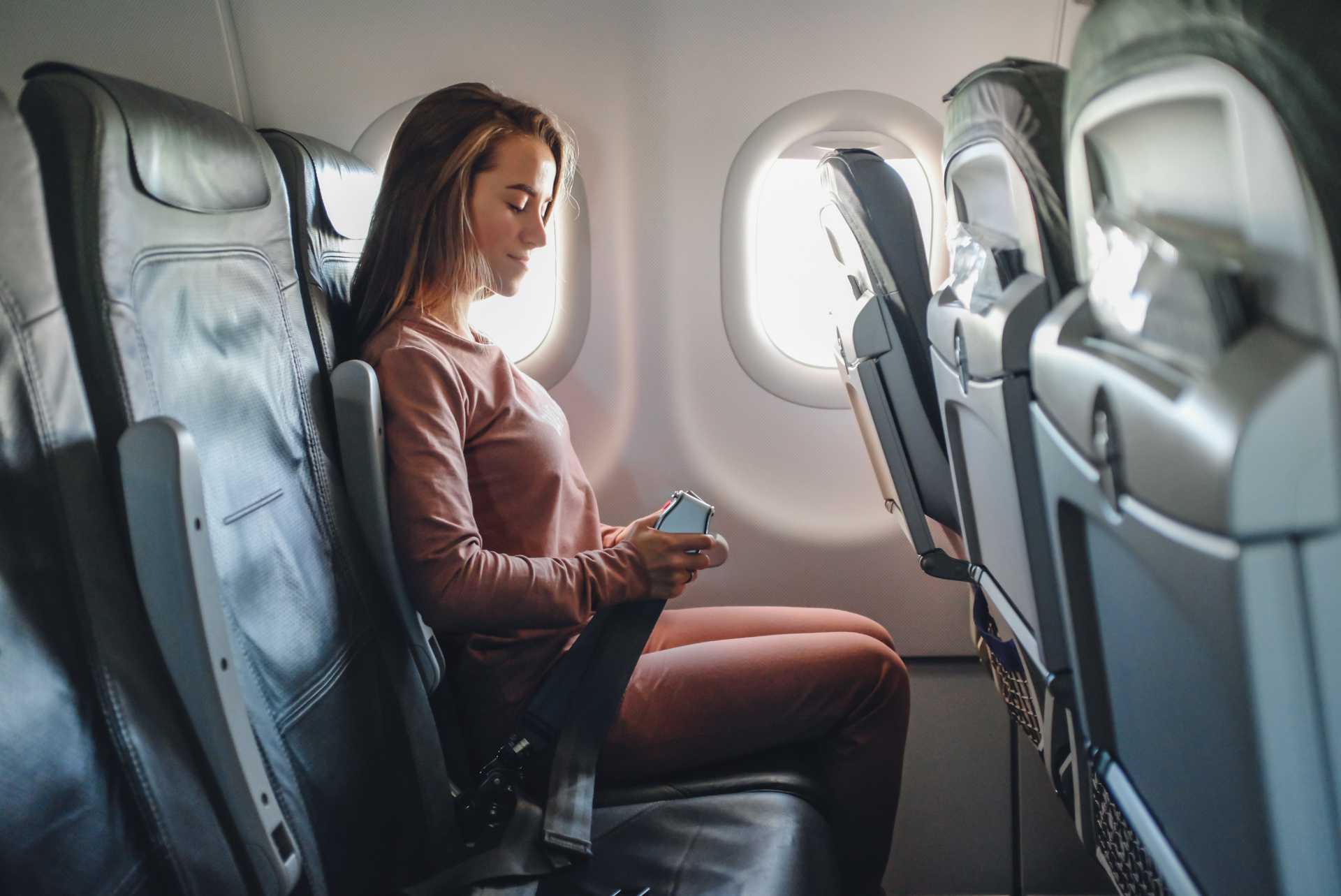 Girl is strapped on the plane
