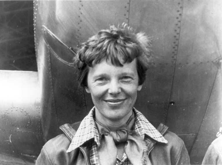 Amelia Earhart in front of plane