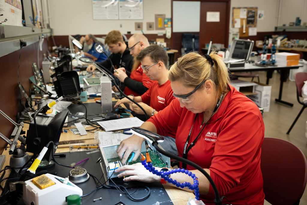 aet students in a lab working on circuits