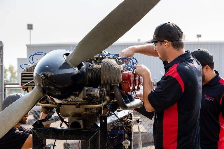 spartan students working on engine
