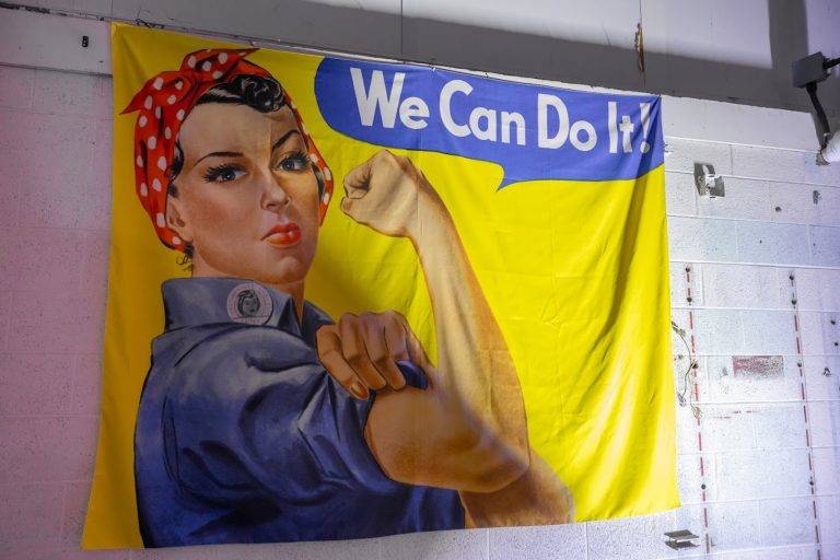 oklahoma women in aviation and aerospace day roses and wrenches event rosie the riveter flag