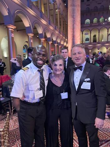 Zack, his mother, and Spartan Education Group CEO Robert Polston